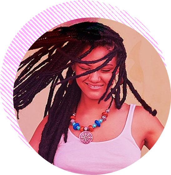 Face of woman with braids smiling and dancing